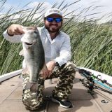 Angler with amazing catch of a great black bass catch at lake Chapala