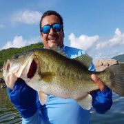 Happy angler with enormous bass catch at Mateos Lake