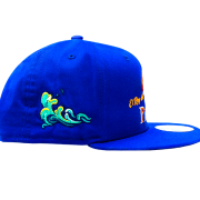 Custom fishing cap with embroidered wave detail on the side.